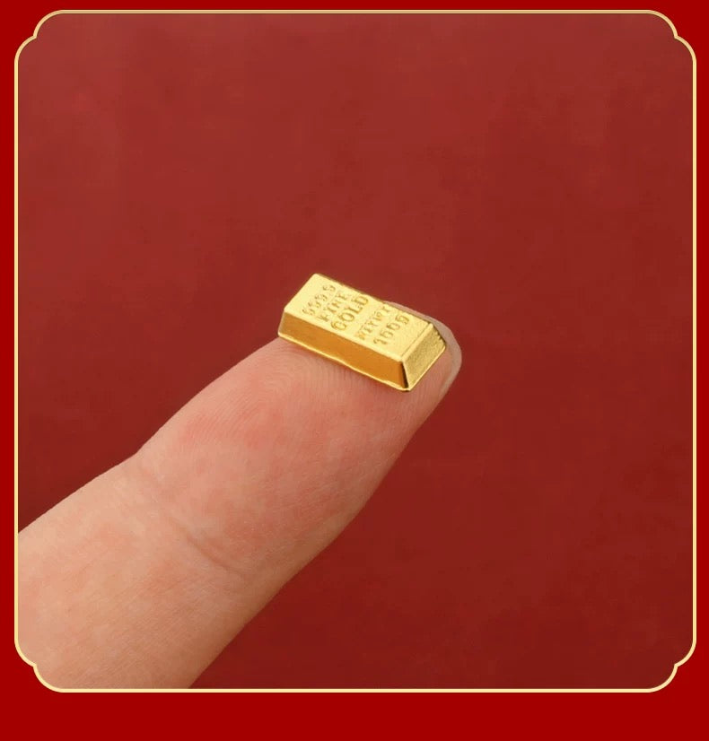 Mini solid gold bar, crown, and Gold Ingot Yuanbao decor.